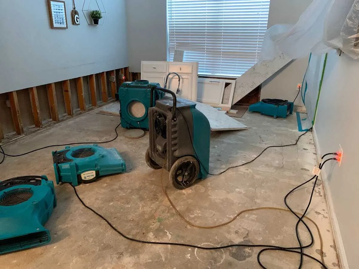 Dehumidifier in flood-cut room for Water Damage Restoration in Aspen